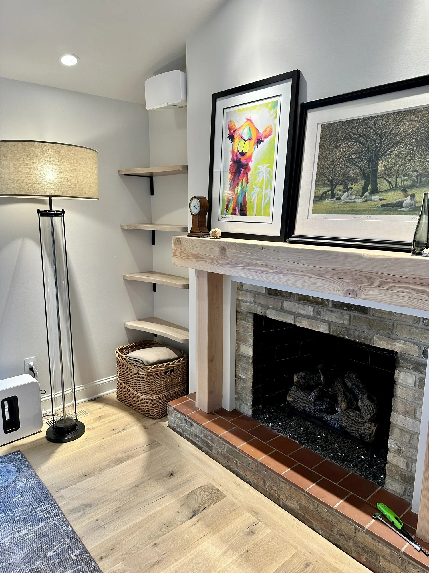 Natural wood fireplace mantel crafted by Bahrke Built